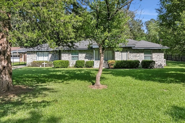 ranch-style house with a front yard