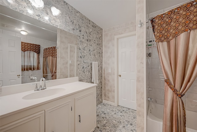 bathroom with shower / bath combo with shower curtain and vanity