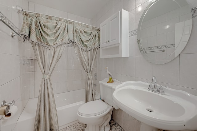 full bathroom with sink, shower / tub combo, toilet, tile walls, and decorative backsplash