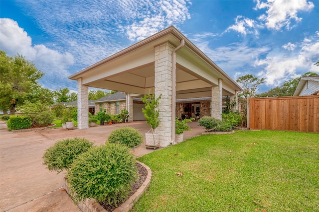 view of side of property with a lawn