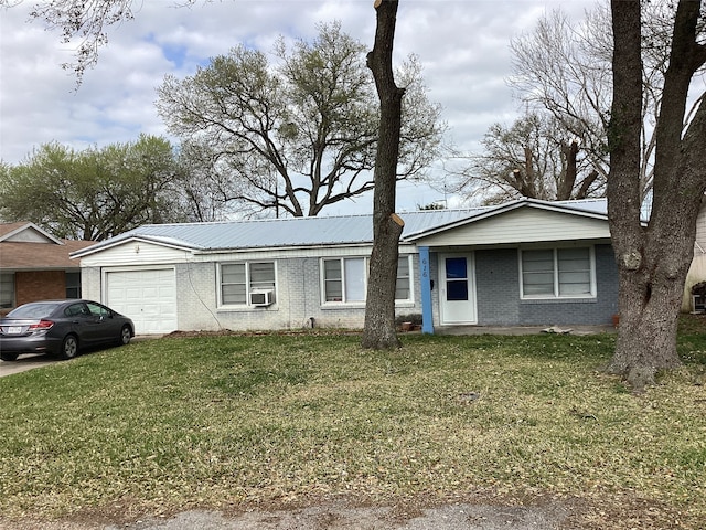 ranch-style home with brick siding, a front yard, cooling unit, metal roof, and a garage