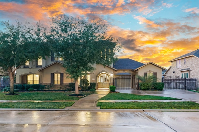 view of front of home with a lawn