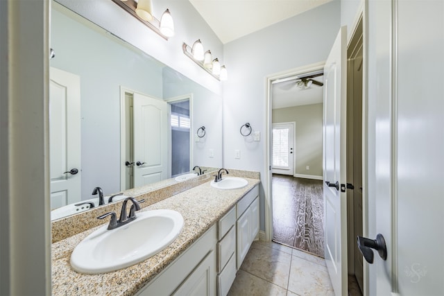 bathroom with ceiling fan, vanity, and hardwood / wood-style flooring