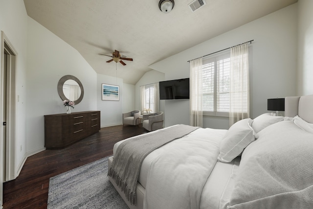 bedroom featuring vaulted ceiling, ceiling fan, and dark wood-type flooring