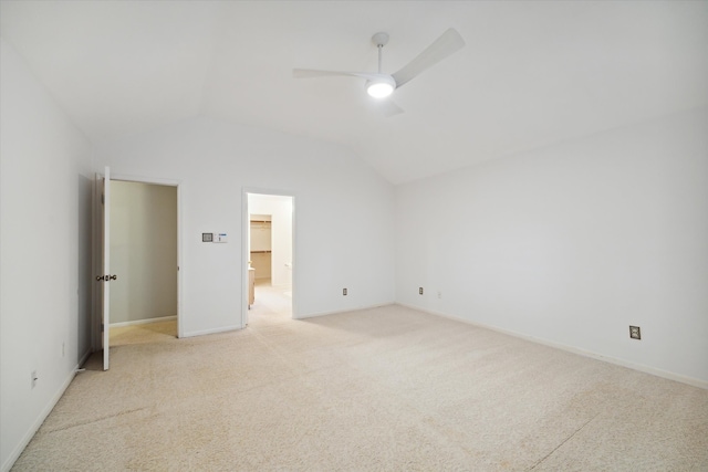 unfurnished bedroom with light carpet, lofted ceiling, and ceiling fan