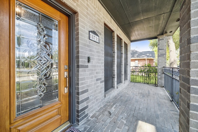 doorway to property with a porch