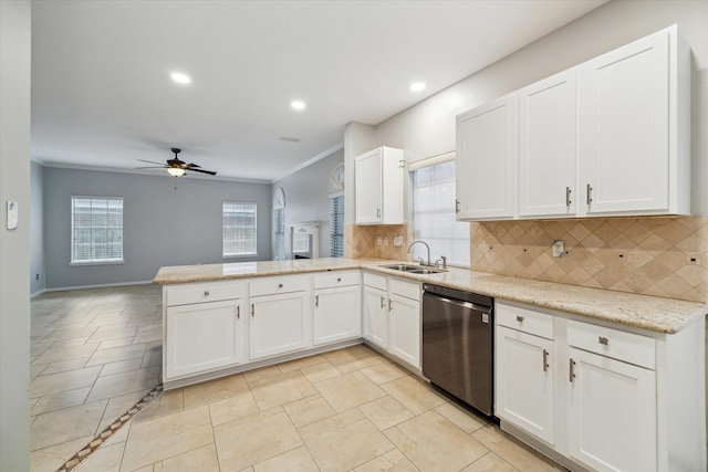 kitchen with kitchen peninsula, dishwasher, white cabinets, and sink