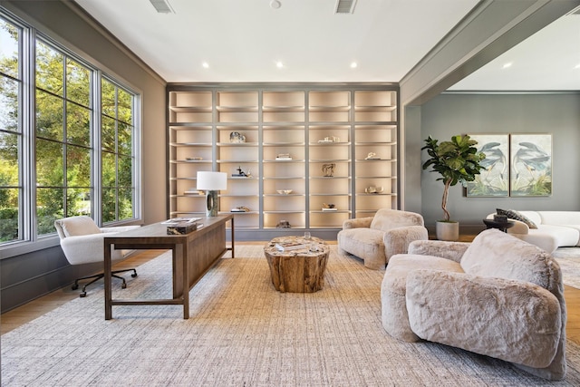 1944 Larchmont Rd, Houston, TX 77019 - office area featuring plenty of natural light, built in shelves, wood finished floors, and recessed lighting
