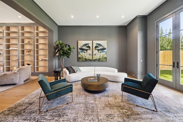 1944 Larchmont Rd, Houston, TX 77019 - sitting room featuring wood finished floors, crown molding, french doors, built in shelves, and recessed lighting