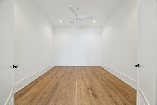 empty room with crown molding, ceiling fan, and light wood-type flooring