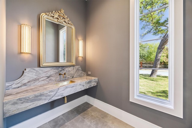 1944 Larchmont Rd, Houston, TX 77019 - bathroom featuring a sink and baseboards