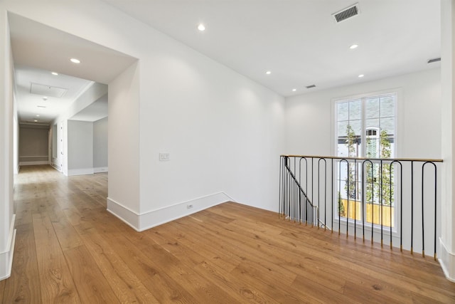 unfurnished room with light hardwood / wood-style flooring