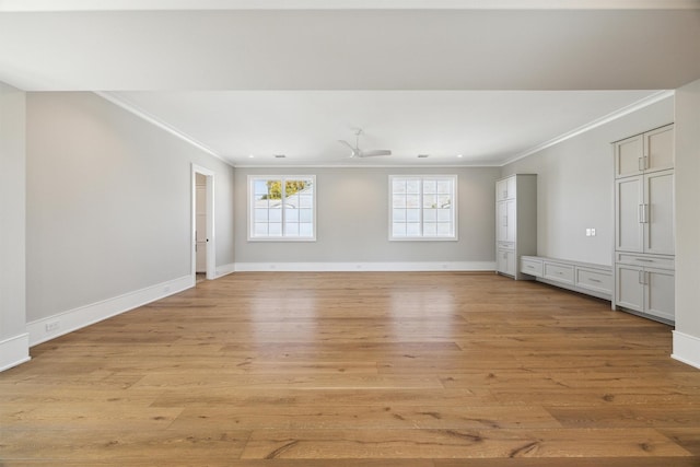 spare room with ceiling fan, light hardwood / wood-style floors, and crown molding