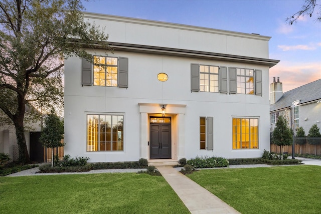 view of front of house with a lawn