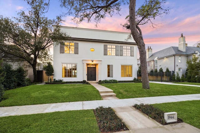 view of front of property with a yard