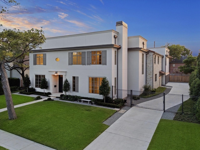 1944 Larchmont Rd, Houston, TX 77019 - view of front of house with concrete driveway, stucco siding, a gate, and a chimney