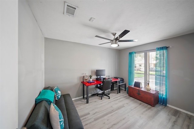 office area with ceiling fan and light wood-type flooring