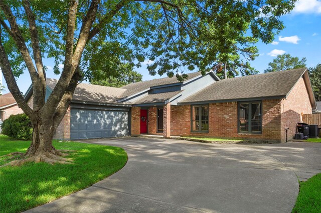 ranch-style home featuring a garage