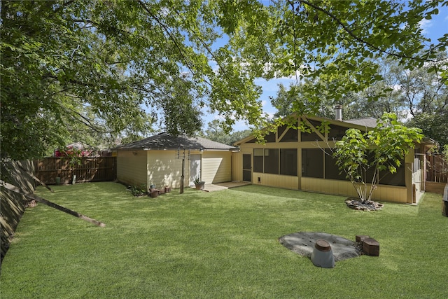 view of yard with a sunroom