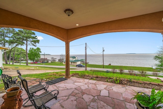 view of patio featuring a water view