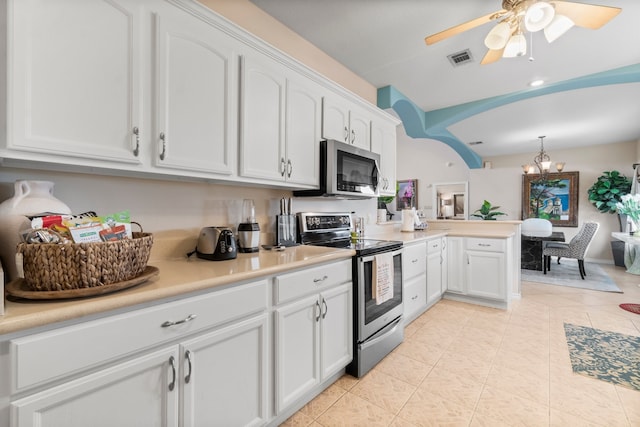 kitchen featuring appliances with stainless steel finishes, kitchen peninsula, white cabinetry, ceiling fan, and light tile patterned floors