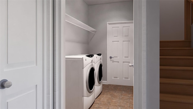 clothes washing area with separate washer and dryer