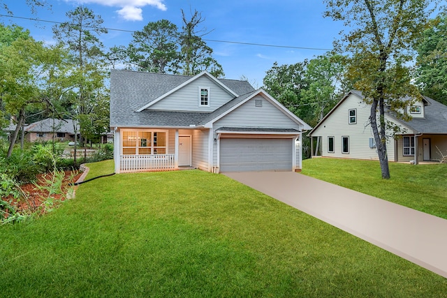 view of front of property with a front lawn, a garage, and a porch