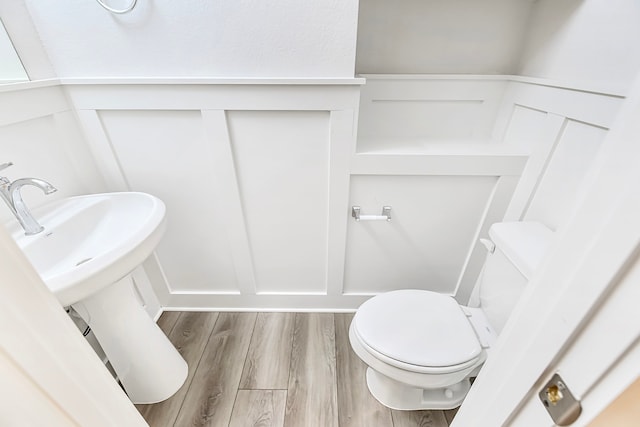 bathroom featuring toilet and hardwood / wood-style floors