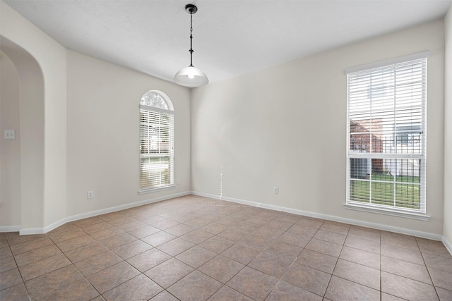 empty room with light tile patterned floors