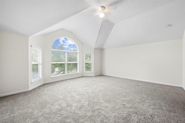 additional living space with ceiling fan, lofted ceiling, and carpet floors