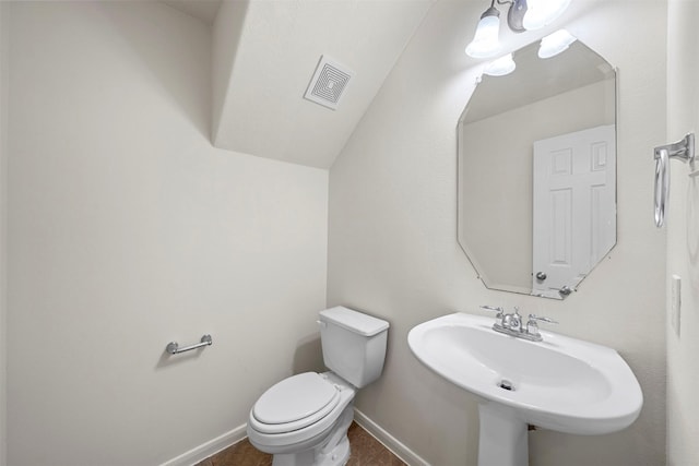 bathroom featuring toilet and sink