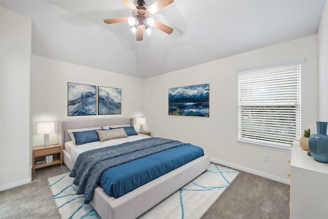 bedroom with light carpet, lofted ceiling, and ceiling fan