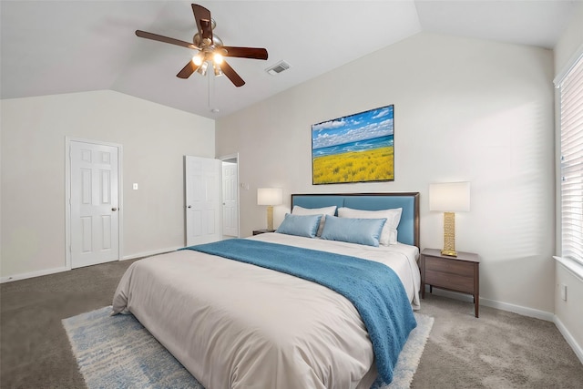 carpeted bedroom featuring multiple windows, vaulted ceiling, and ceiling fan