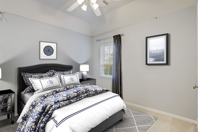 bedroom featuring ceiling fan and light carpet