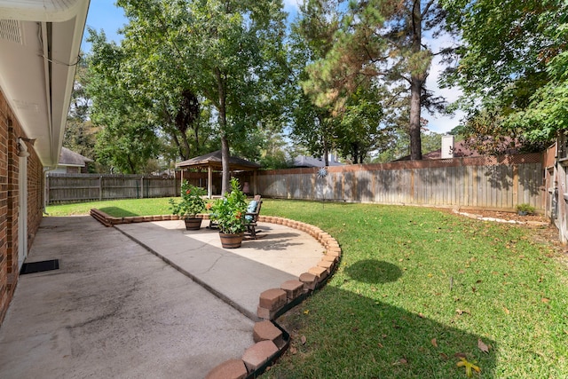 view of yard with a gazebo and a patio