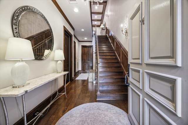 stairway featuring hardwood / wood-style flooring and ornamental molding