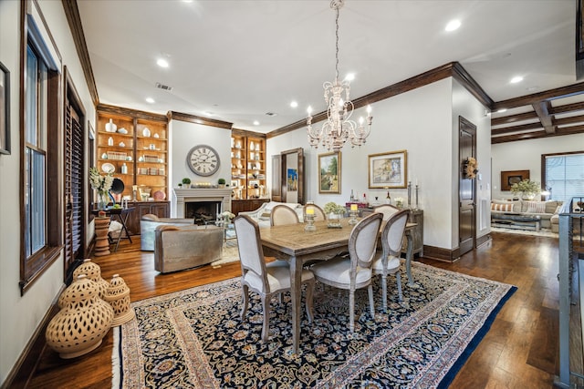 dining area with crown molding, dark hardwood / wood-style floors, a chandelier, and beam ceiling