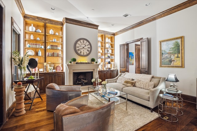 living room with dark hardwood / wood-style floors, built in features, vaulted ceiling, and ornamental molding