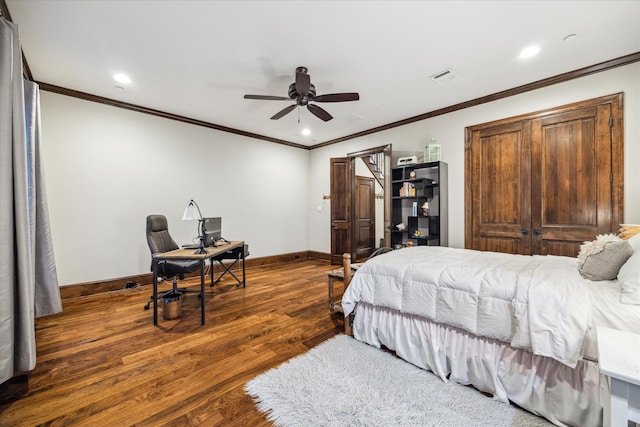 bedroom featuring dark hardwood / wood-style flooring, ceiling fan, and crown molding