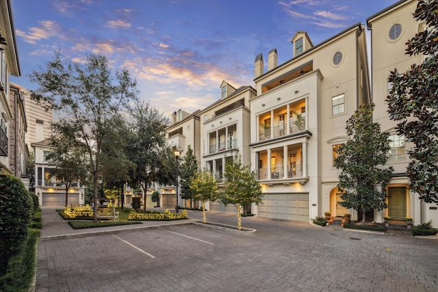 outdoor building at dusk with a garage