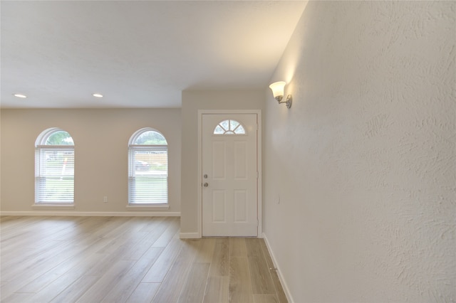 entryway with light hardwood / wood-style flooring