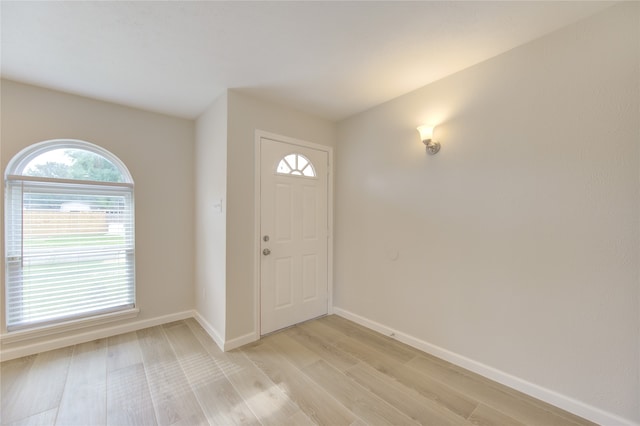 foyer entrance with light wood-type flooring