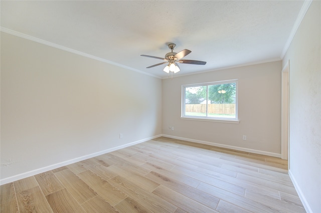 spare room featuring ceiling fan, crown molding, and light hardwood / wood-style flooring