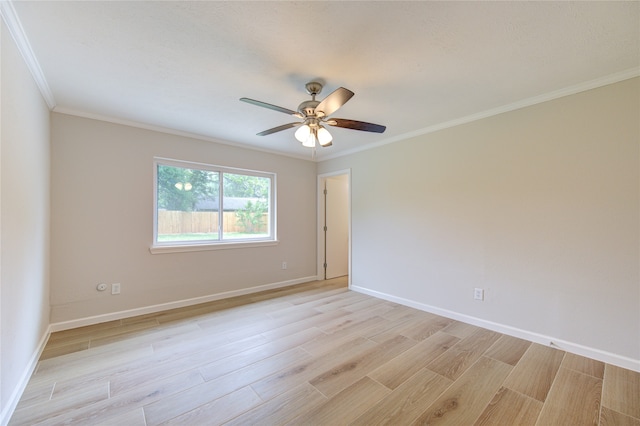 empty room with ornamental molding, light wood-type flooring, and ceiling fan