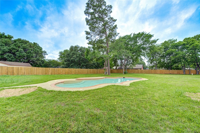 view of swimming pool featuring a lawn