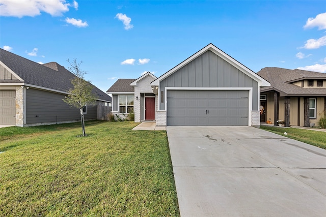 view of front of property with a front yard and a garage