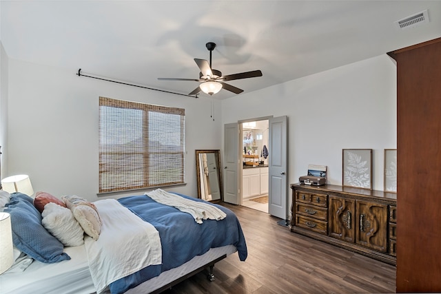 bedroom featuring ensuite bathroom, dark hardwood / wood-style floors, and ceiling fan