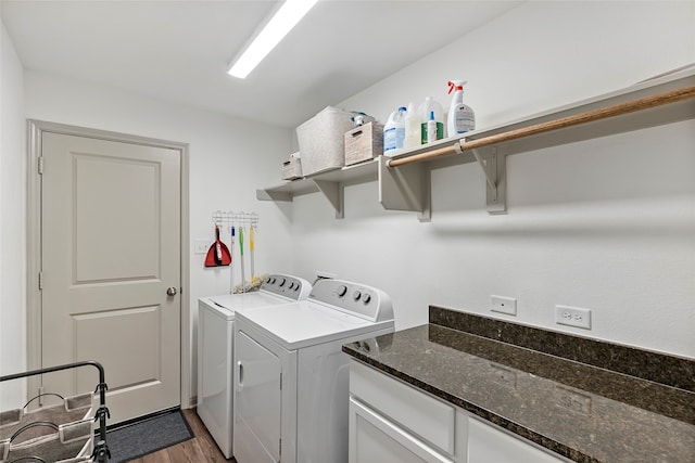 laundry room with washing machine and dryer and dark hardwood / wood-style floors