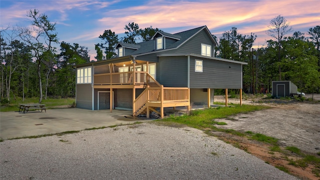 view of back house at dusk