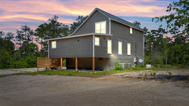 property exterior at dusk with central air condition unit